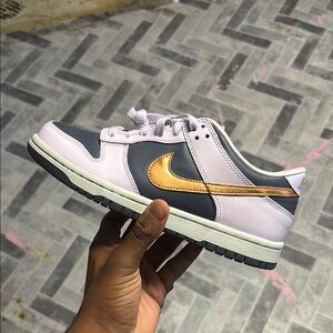 Nike Gold and Gray Sneakers with Classic Design